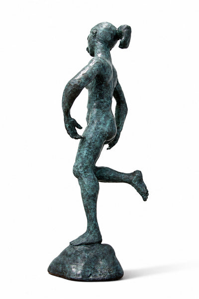 A bronze sculpture of a nude female figure in a dynamic pose, standing on a round base with a textured, verdigris patina finish, photographed against a solid white background.
